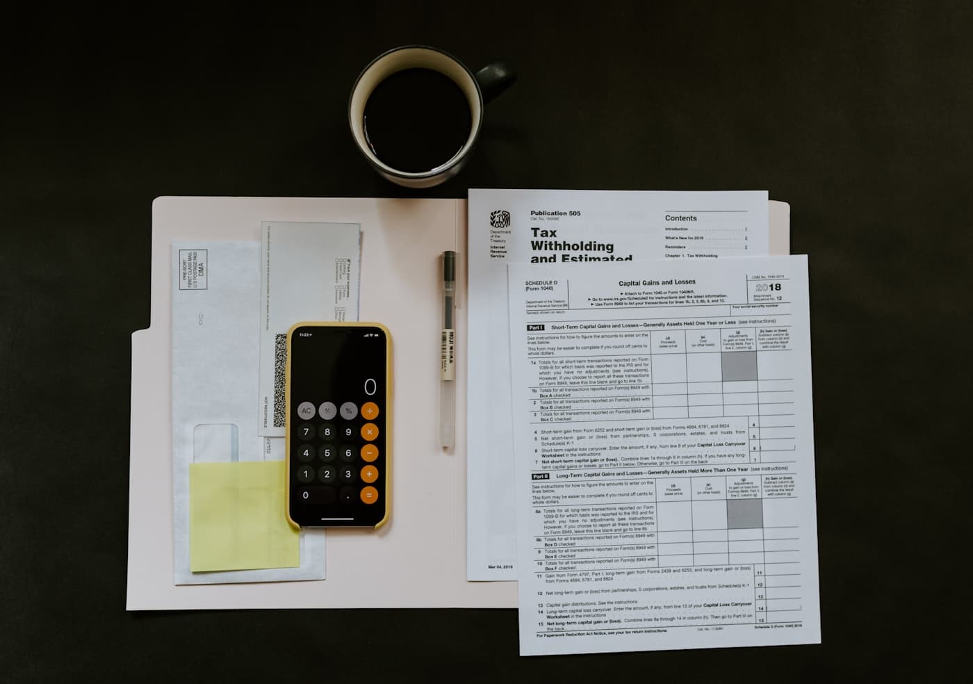 Bank statements and calculator on a desk